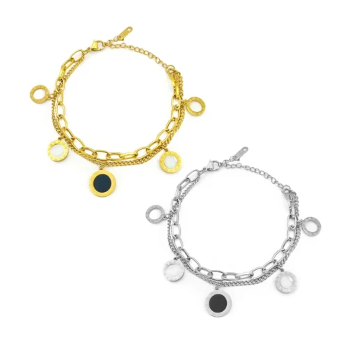 Brazalete de acero inoxidable con nudo cruzado y micro cristales en acabado dorado y plateado sobre fondo blanco