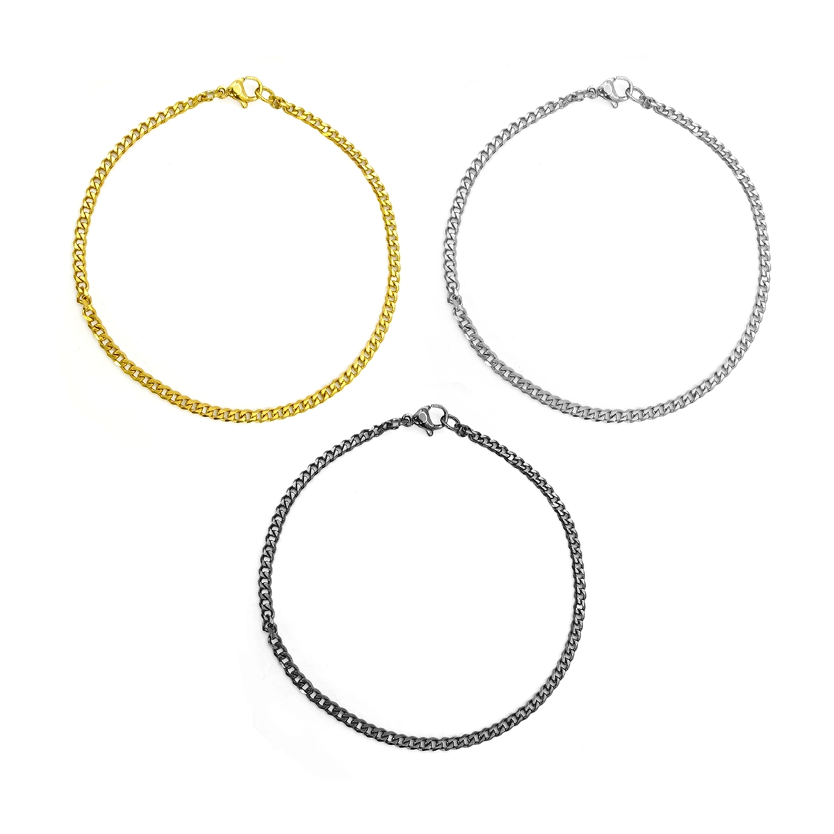 Pulsera cubana delgada de acero inoxidable para hombre en acabados dorado, plateado y negro sobre fondo blanco