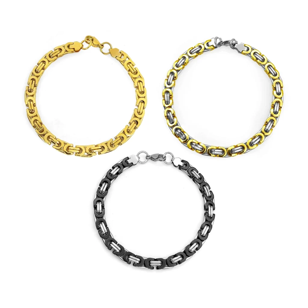 Pulsera Acero Dorado Doble Planchada Estrellas Colgantes 14 Pulsera bizantina de acero inoxidable para hombre en acabado dorado, bicolor dorado con plateado y bicolor negro con plateado sobre fondo blanco