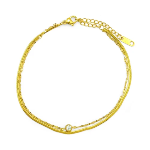 tobillera doble dorada con cristal en acero inoxidable, cadena planchada y petatillo sobre fondo blanco