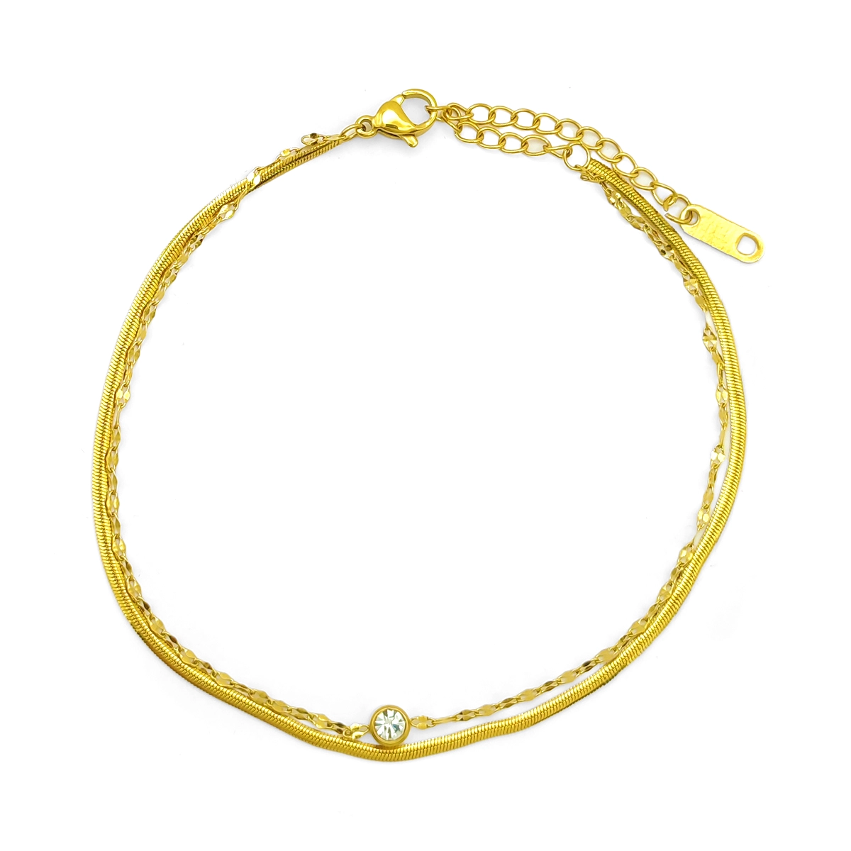 tobillera doble dorada con cristal en acero inoxidable, cadena planchada y petatillo sobre fondo blanco